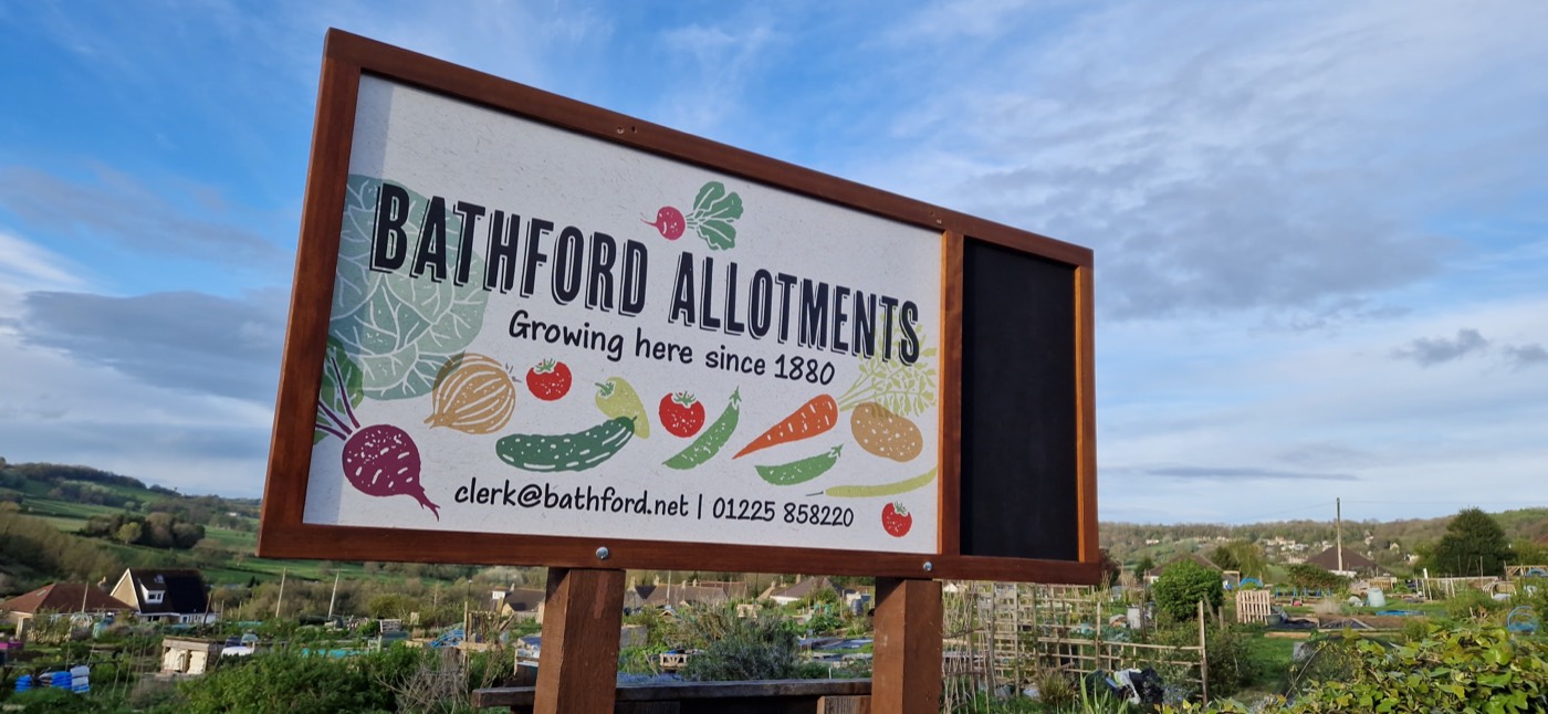 The Bathford Allotments noticeboard, with the site and the valley beyond behind it